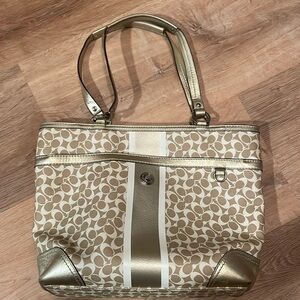 Gold and white coach bag